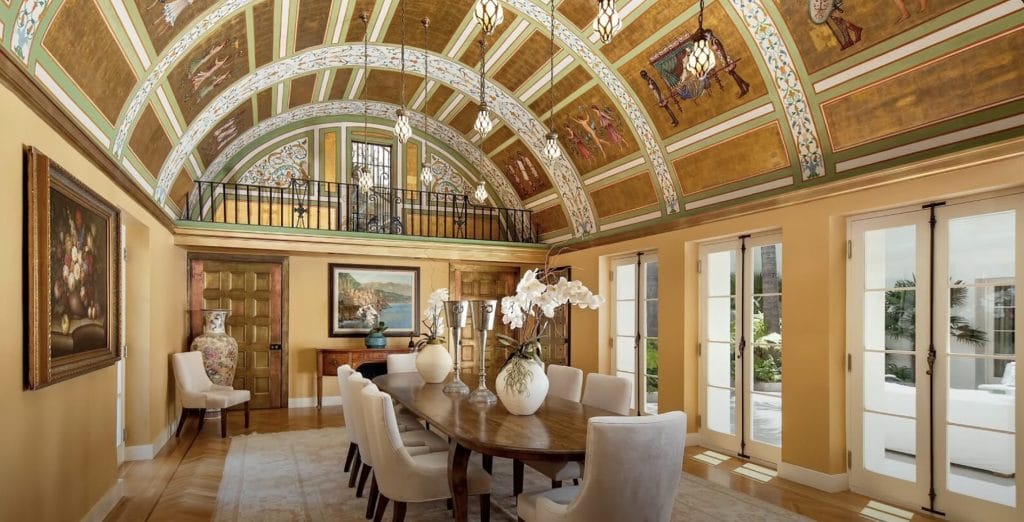 The dining room in front of glass doors that guve a view of the outside.